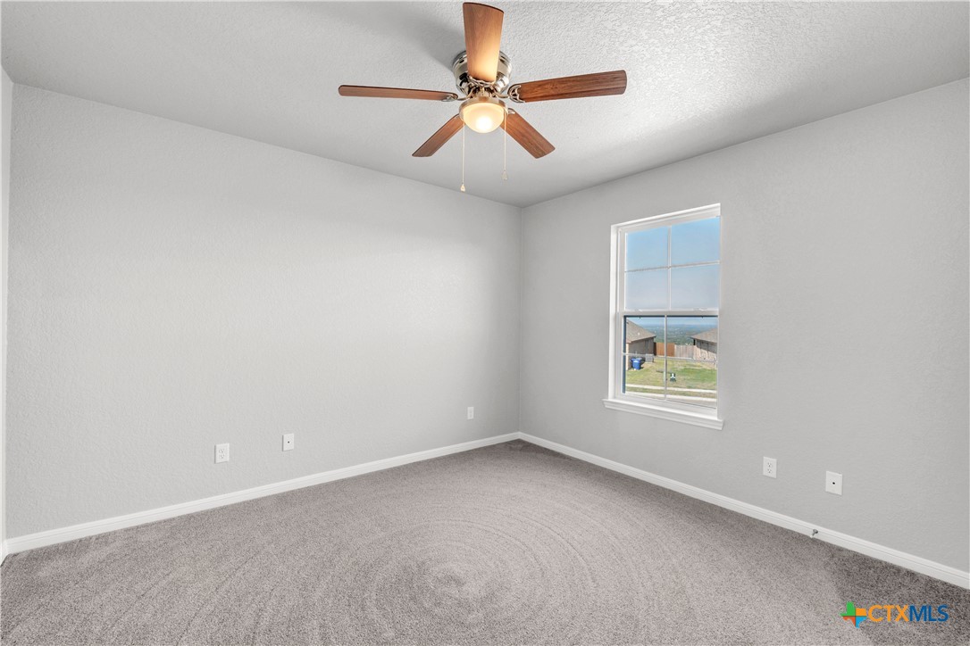 215 Overlook Trail Copperas Cove, TX 76522 - Photo 34 of 36 an empty room with a window and a fan