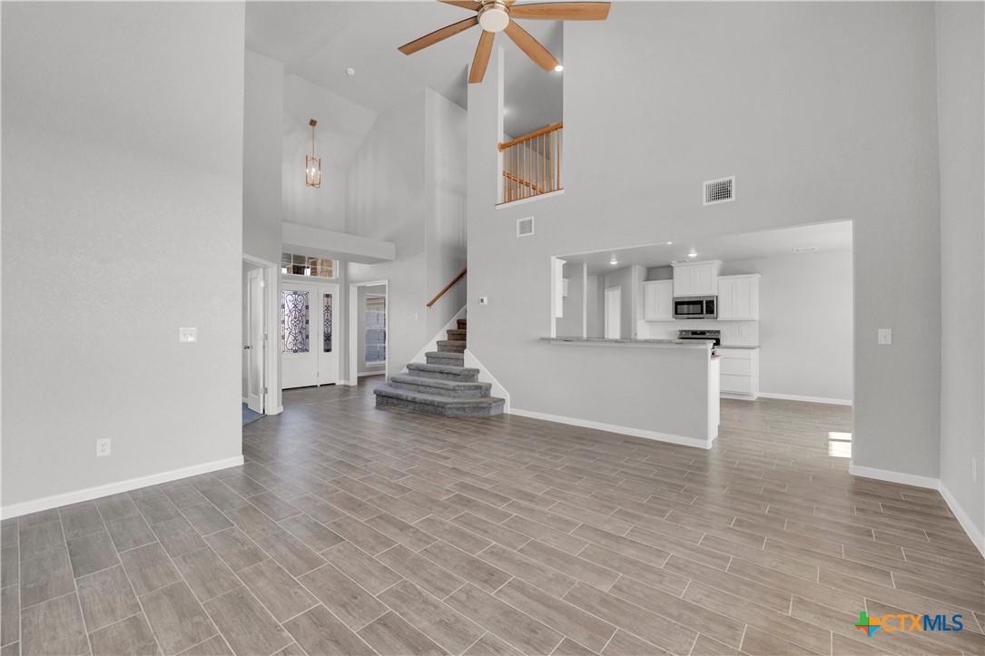 215 Overlook Trail Copperas Cove, TX 76522 - Photo 10 of 36 a view of a kitchen with wooden floor and a kitchen