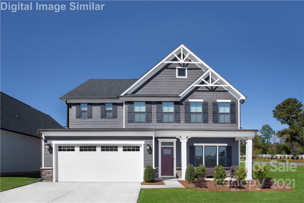 7230 Waterwheel Street Southwest, Unit 100 Concord, NC 28025 - Photo 1 of 23 a front view of a house with yard