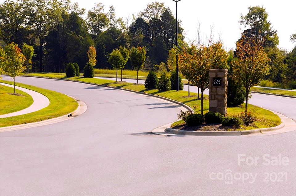7230 Waterwheel Street Southwest, Unit 100 Concord, NC 28025 - Photo 18 of 23 a view of a swimming pool with an outdoor space and seating area