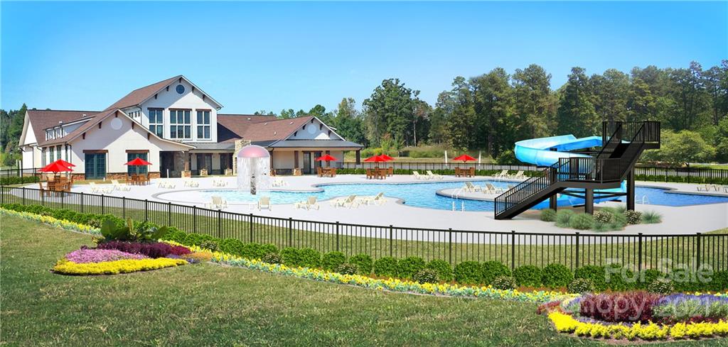 7230 Waterwheel Street Southwest, Unit 100 Concord, NC 28025 - Photo 19 of 23 a garden view with a seating space and fir pit