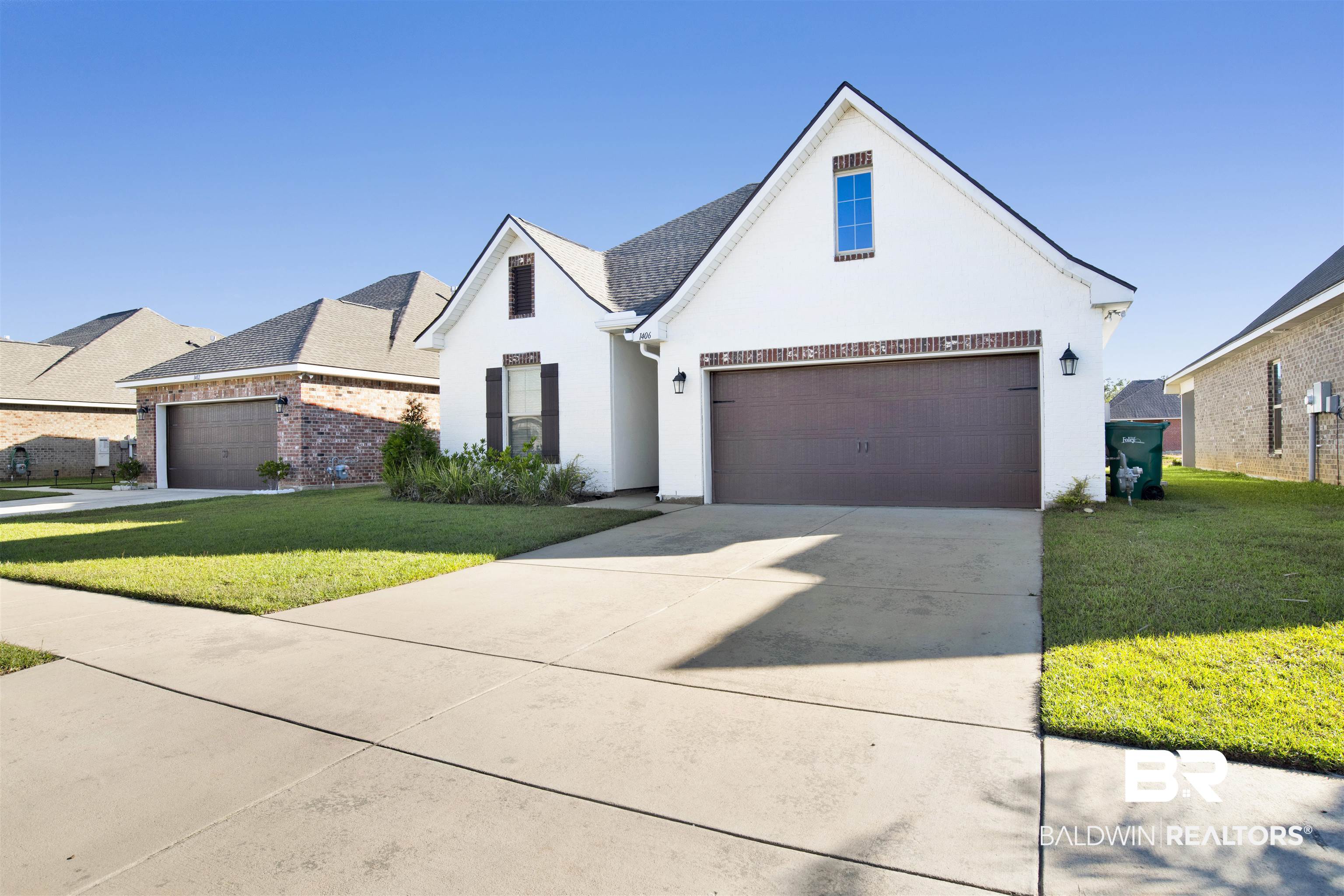 1406 Aldon Street Foley, AL 36535 - Photo 2 of 30 View of front of home with a garage and a front lawn
