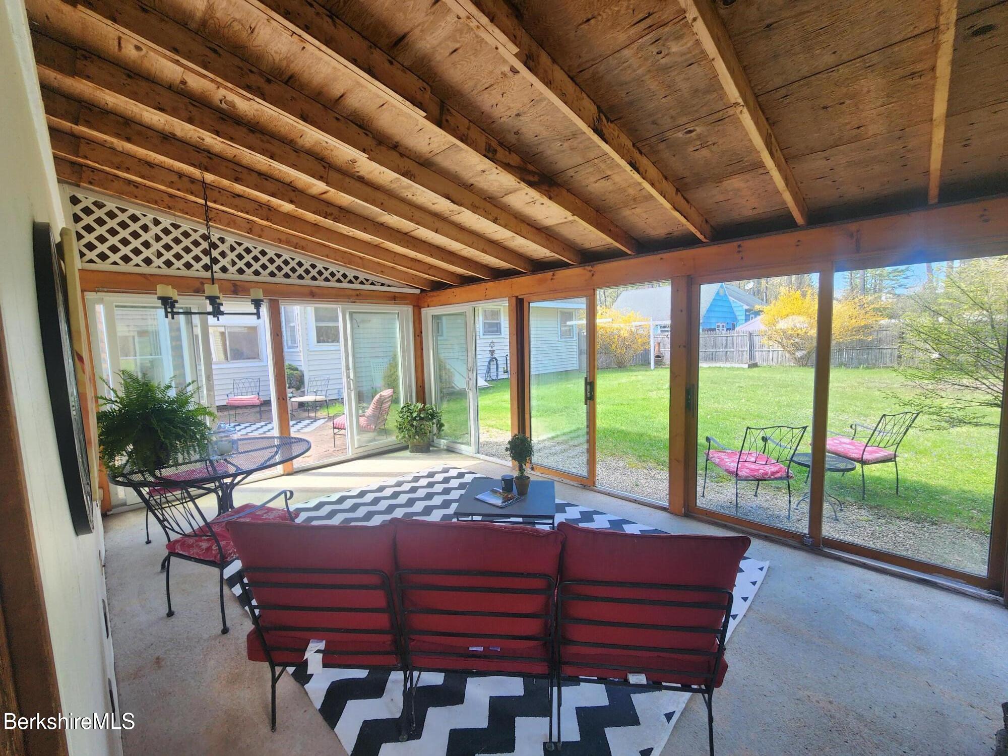 16 East New Lenox Road Lenox, MA 01240 - Photo 16 of 31 a living room with furniture large windows and wooden floor