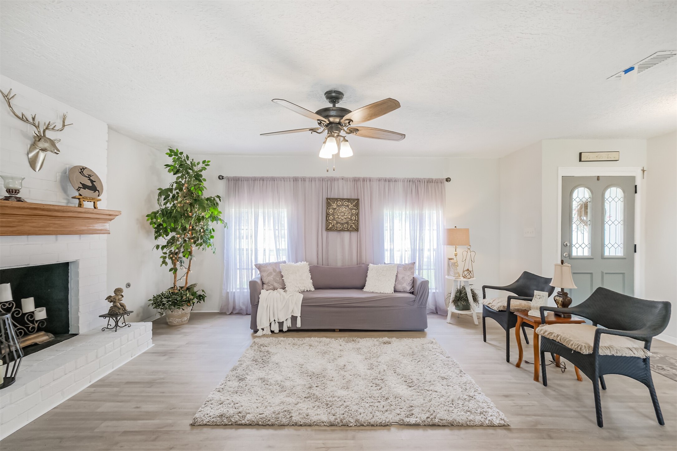 2705 Parrott Avenue Rosenberg, TX 77471 - Photo 4 of 37 a living room with furniture and a fireplace