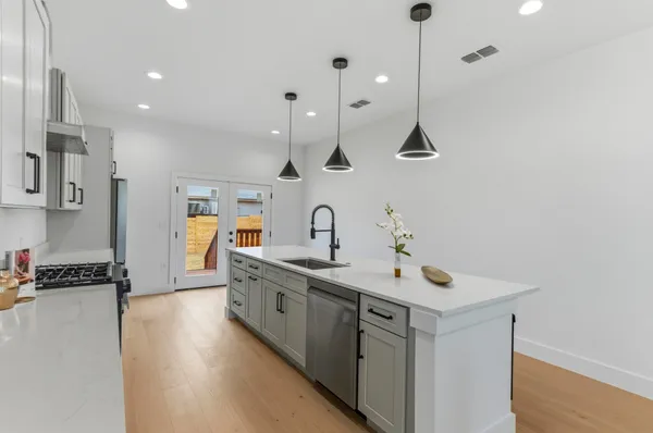 a spacious bathroom with a sink and a mirror