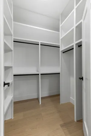 a view of an empty walk in closet