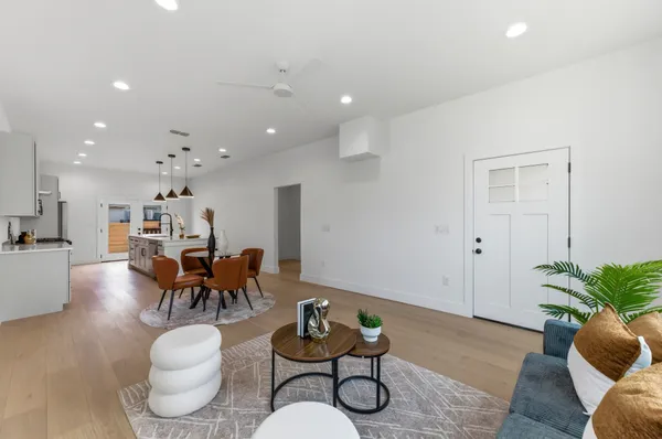 a living room with furniture and a potted plant
