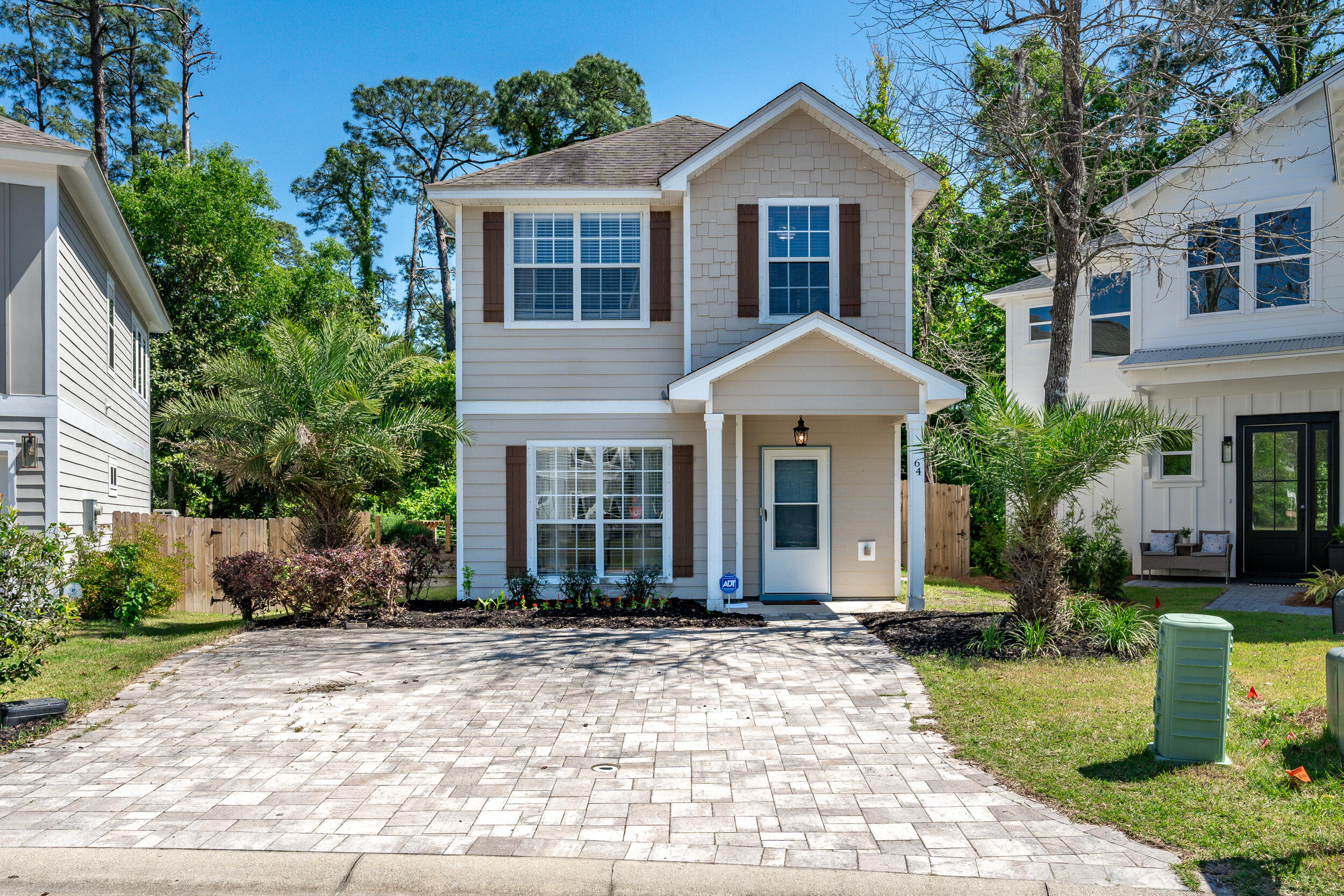 64 Rearden Way Santa Rosa Beach, FL 32459 - Photo 1 of 44 a front view of a house with a yard and plants