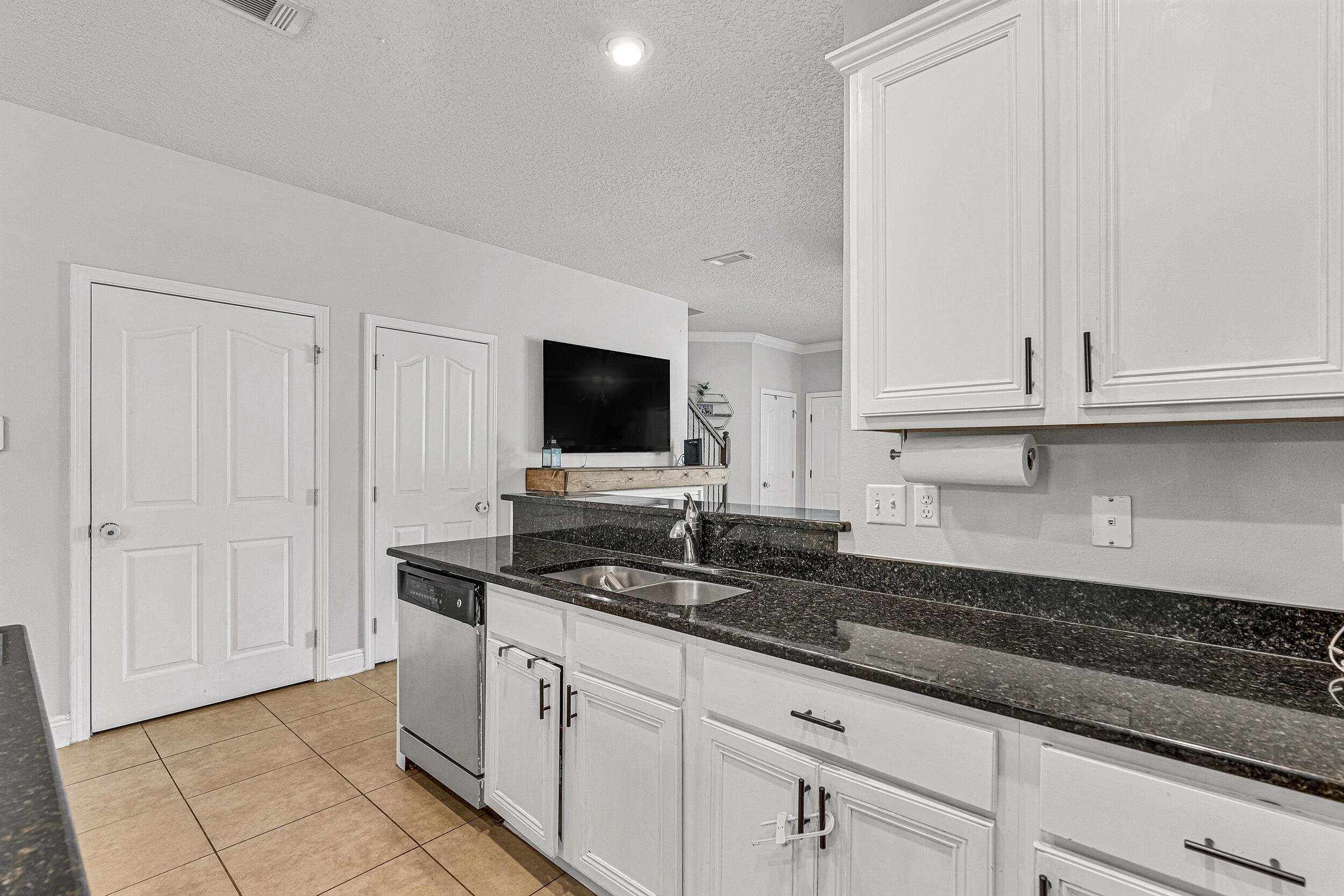 64 Rearden Way Santa Rosa Beach, FL 32459 - Photo 14 of 44 a kitchen with granite countertop white cabinets and a sink