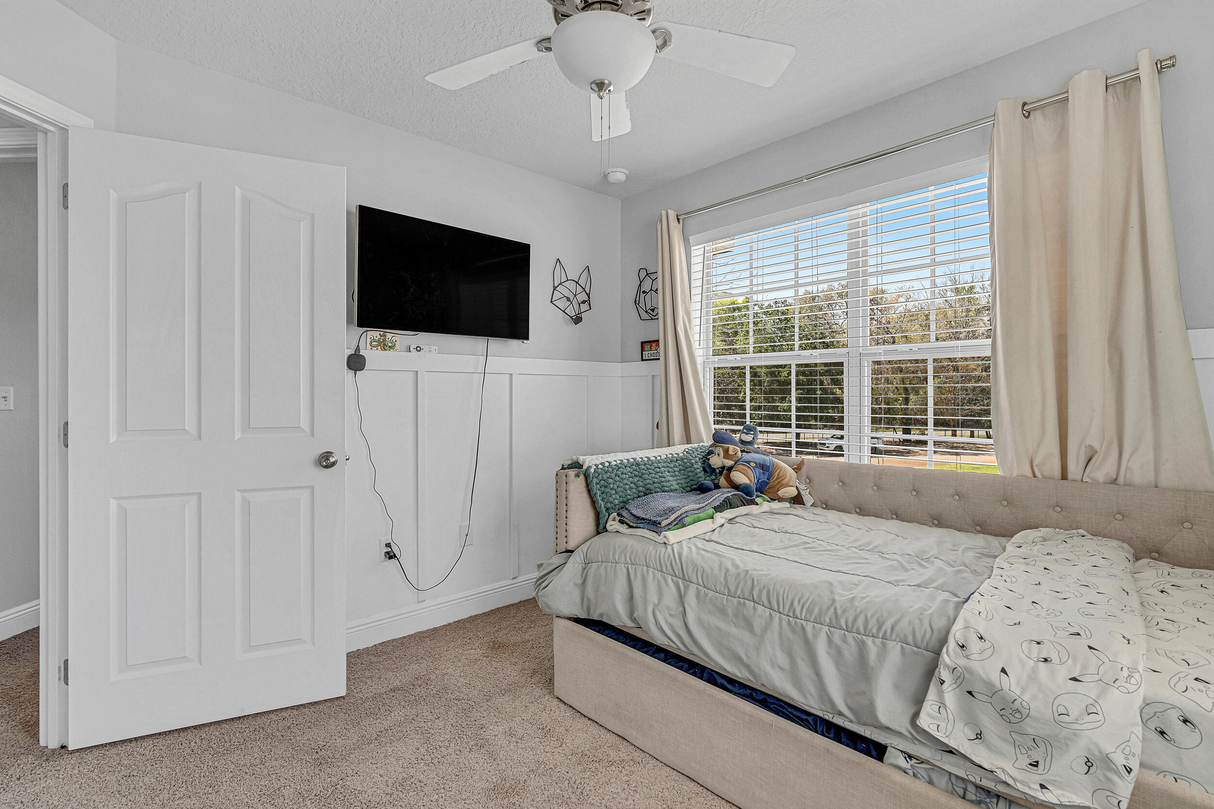 64 Rearden Way Santa Rosa Beach, FL 32459 - Photo 26 of 44 a bedroom with a bed and a flat screen tv