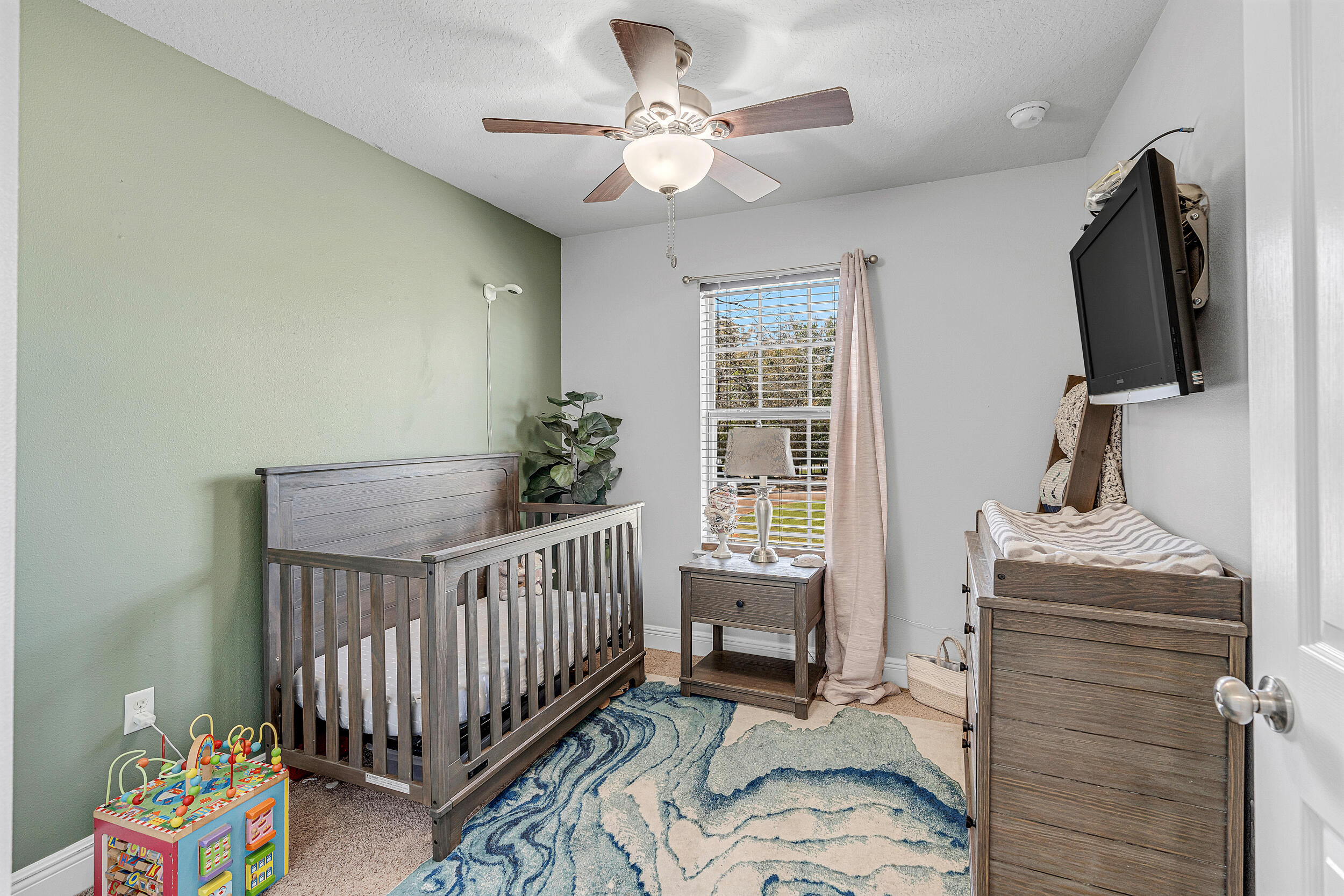 64 Rearden Way Santa Rosa Beach, FL 32459 - Photo 27 of 44 a bedroom with furniture and a window