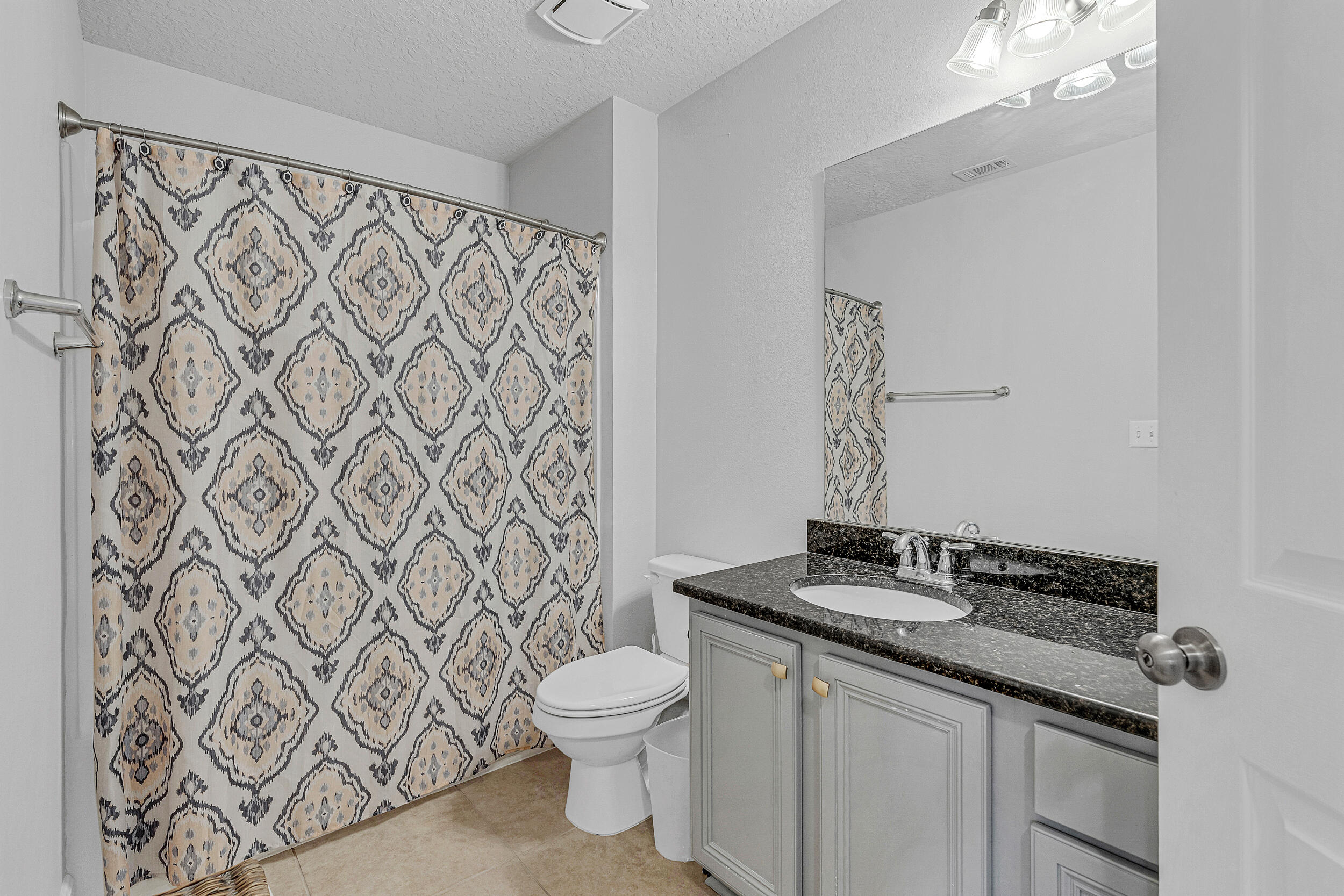 64 Rearden Way Santa Rosa Beach, FL 32459 - Photo 29 of 44 a bathroom with a granite countertop sink and a mirror