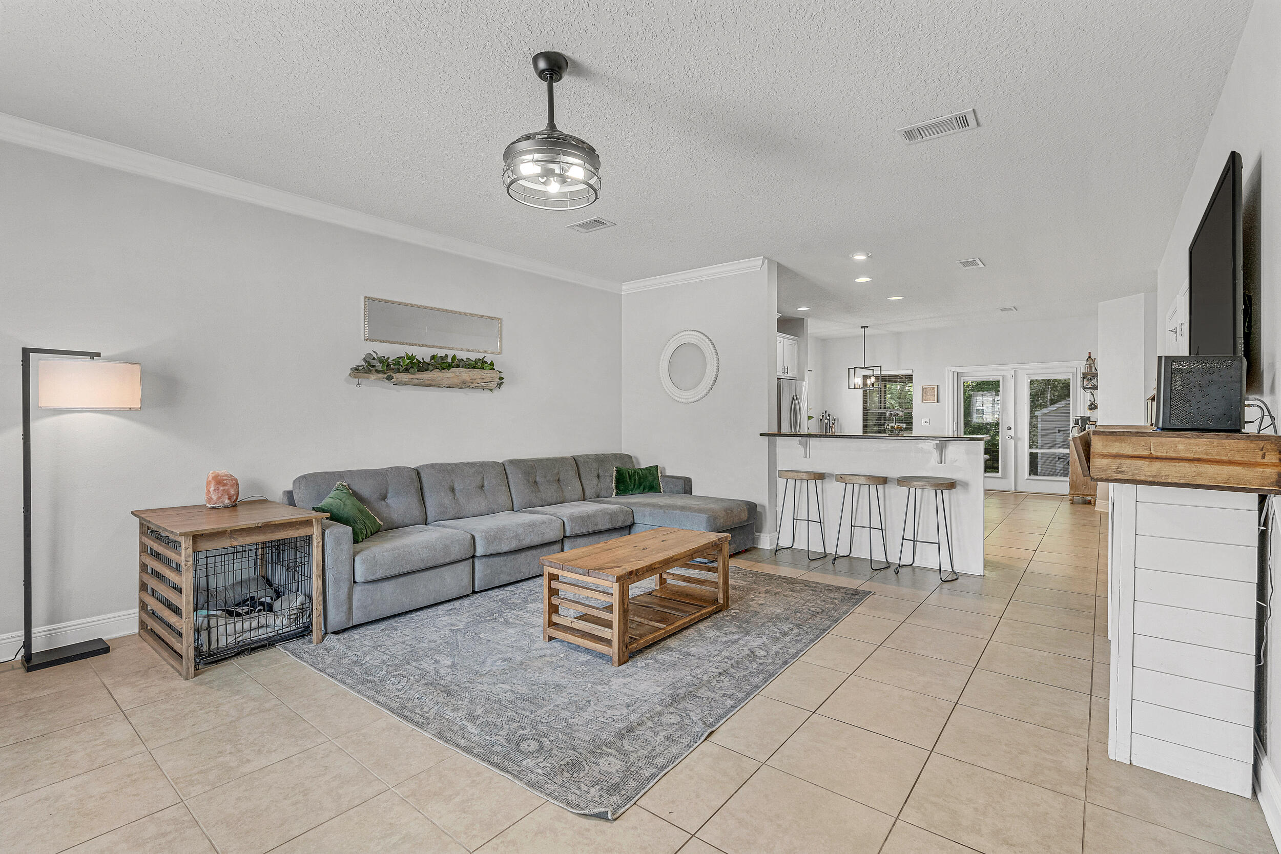 64 Rearden Way Santa Rosa Beach, FL 32459 - Photo 5 of 44 a living room with furniture and a flat screen tv
