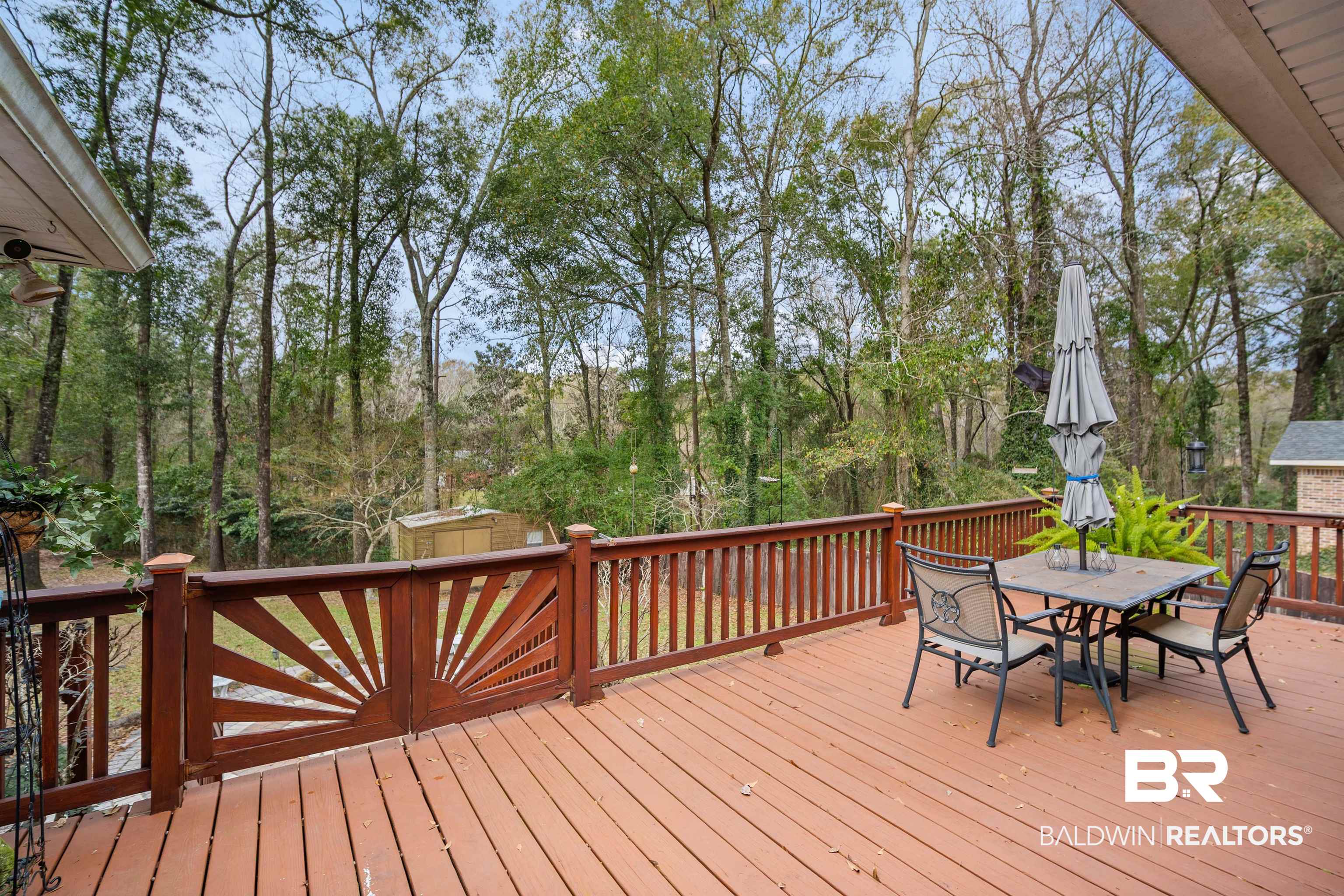 1744 Aden Road Mobile, AL 36695 - Photo 31 of 35 Deck featuring a storage shed