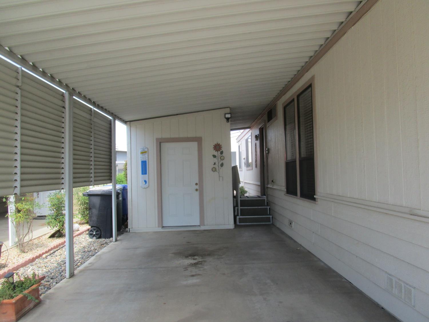 1500 Held Drive, Unit 94 Modesto, CA 95355 - Photo 23 of 32 Covered Carport and Storage Shed