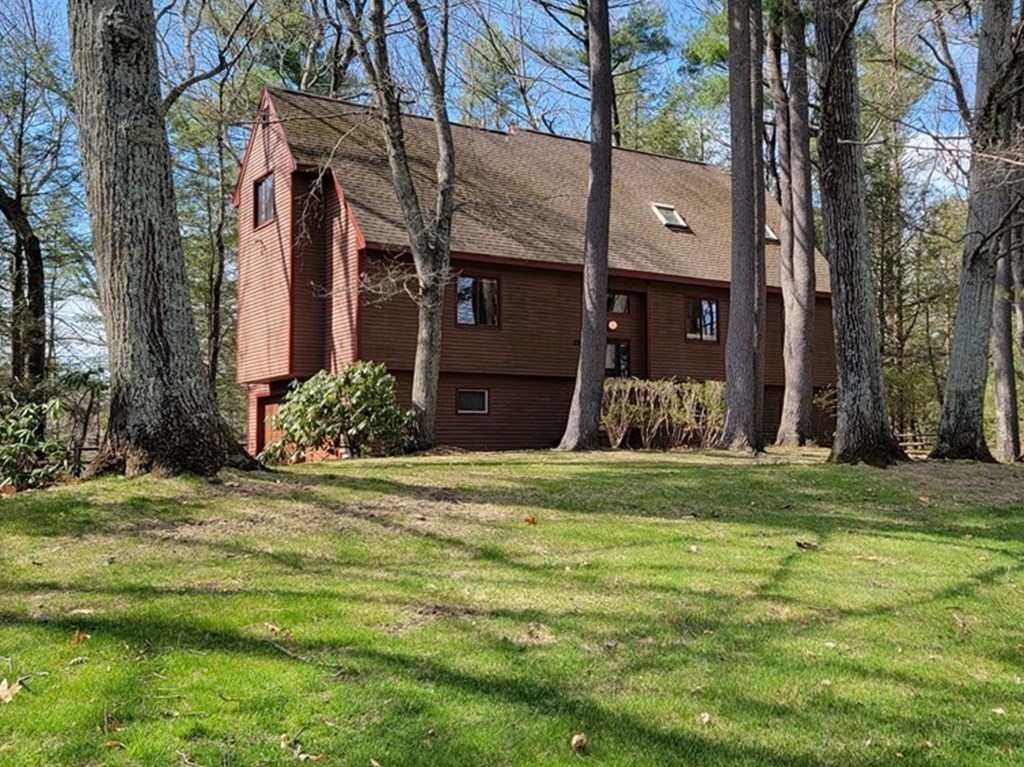 22 Wildwood Road Stow, MA 01775 - Photo 1 of 35 a front view of a house with a garden
