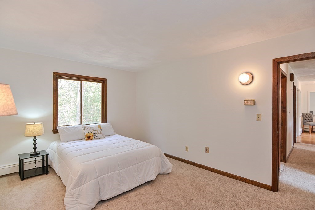 22 Wildwood Road Stow, MA 01775 - Photo 19 of 35 a bedroom with a bed and a window
