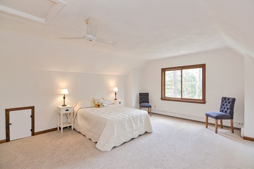 22 Wildwood Road Stow, MA 01775 - Photo 24 of 35 a bedroom with a bed and a window