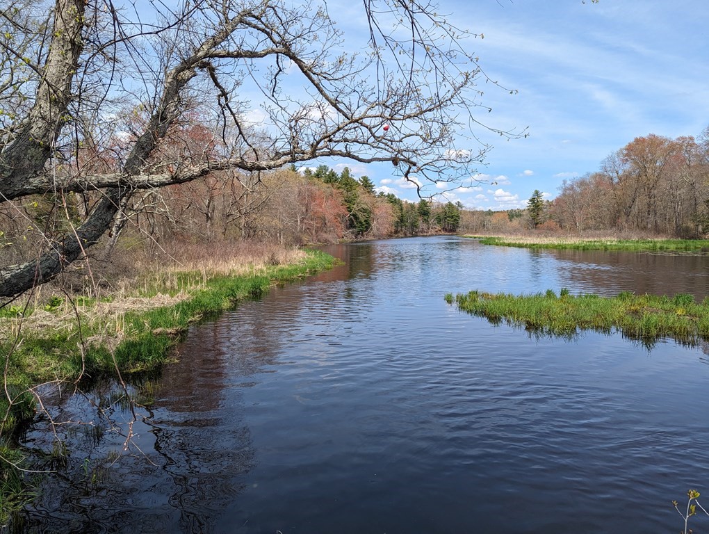 22 Wildwood Road Stow, MA 01775 - Photo 33 of 35 a view of a lake with houses in the back