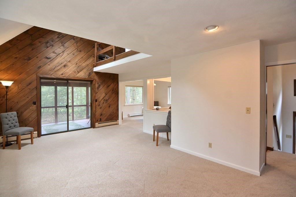 22 Wildwood Road Stow, MA 01775 - Photo 4 of 35 a view of a livingroom with furniture and a window