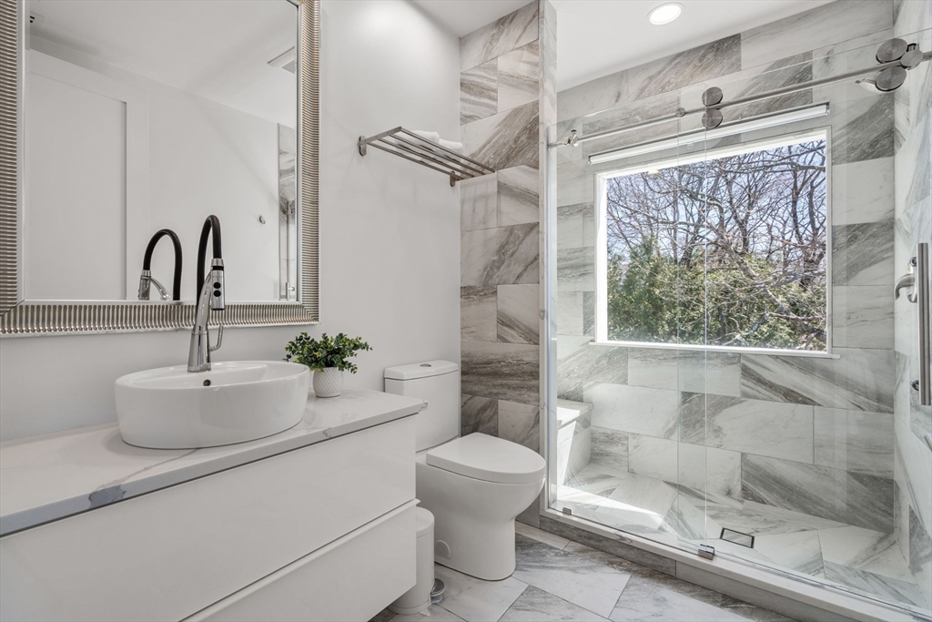 30 Whipple Road Lexington, MA 02420 - Photo 12 of 28 a bathroom with a sink toilet and shower