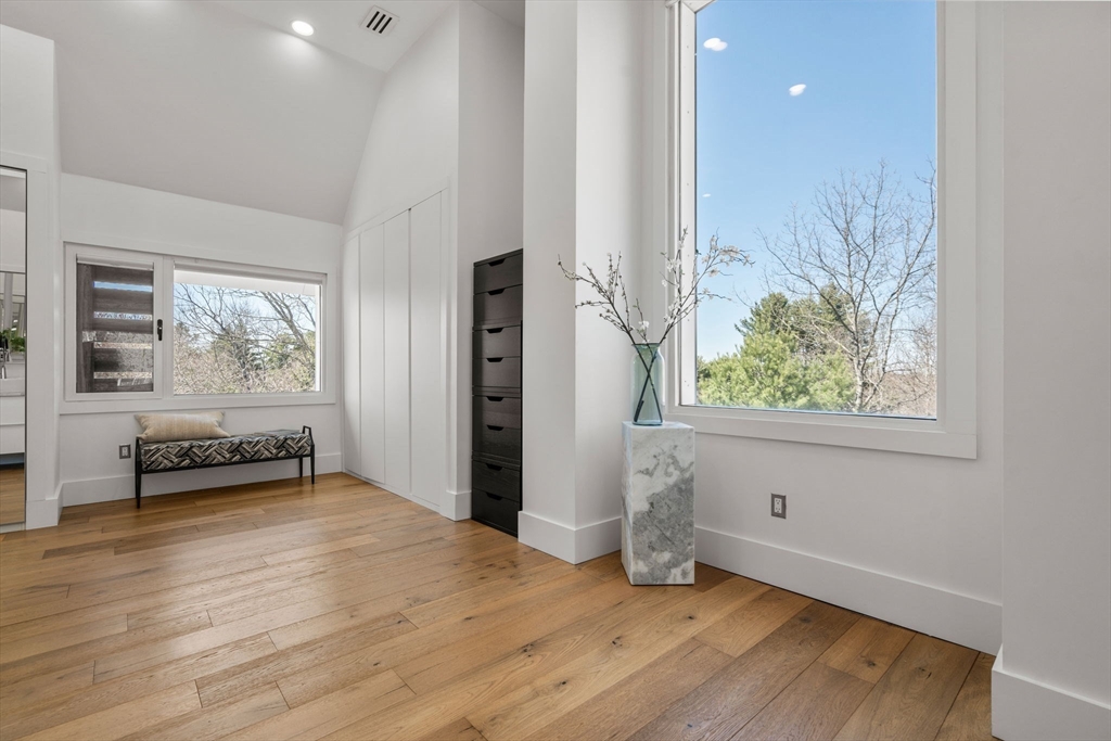 30 Whipple Road Lexington, MA 02420 - Photo 16 of 28 an empty room with wooden floor and windows