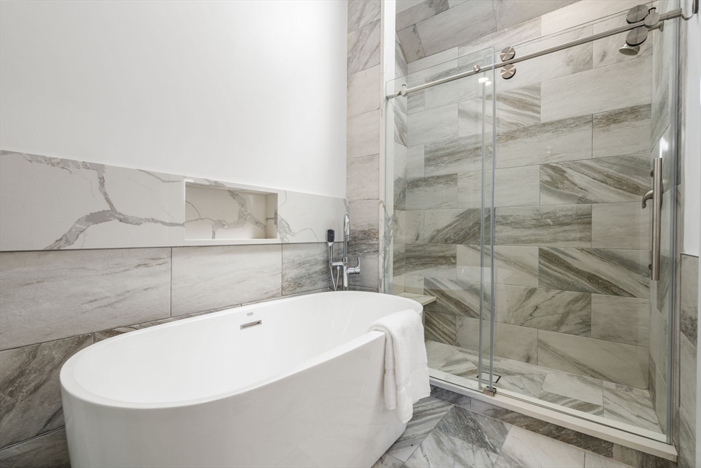 30 Whipple Road Lexington, MA 02420 - Photo 18 of 28 a bathroom with a bathtub and shower