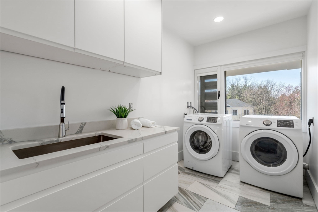 30 Whipple Road Lexington, MA 02420 - Photo 28 of 28 a utility room with sink dryer and washer