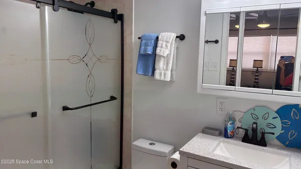 a bathroom with a sink and mirror