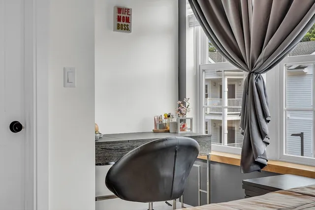 a view of a livingroom with furniture and staircase