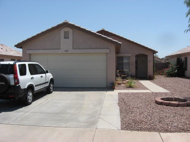 15007 West Redfield Road Surprise, AZ 85379 - Photo 1 of 5 a front view of a house with a yard