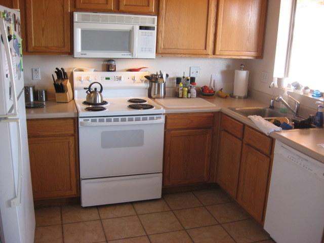 15007 West Redfield Road Surprise, AZ 85379 - Photo 3 of 5 a kitchen with a sink stove and cabinets