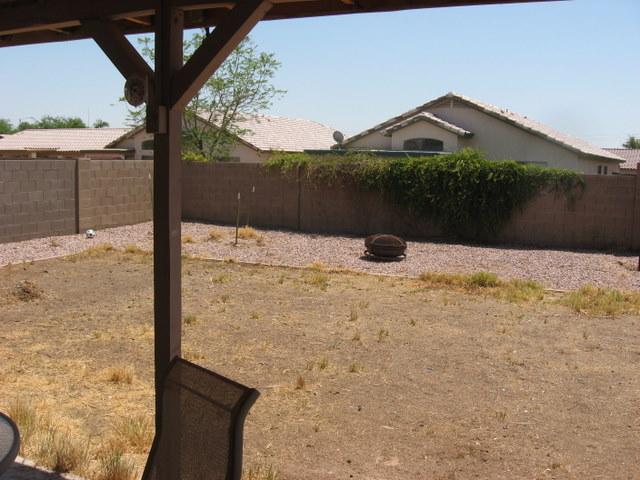 15007 West Redfield Road Surprise, AZ 85379 - Photo 5 of 5 a street view with wooden fence