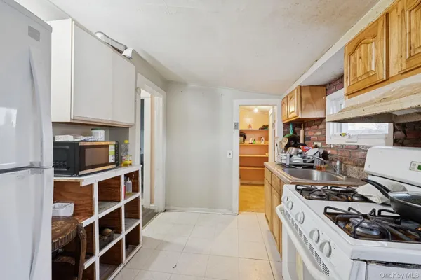 a kitchen with a stove and a refrigerator