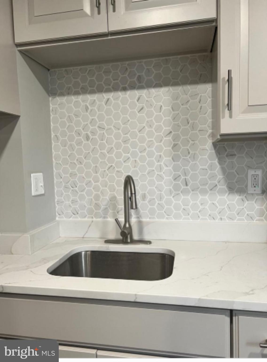 1206 11th Street Northwest Washington, DC 20005 - Photo 12 of 44 a close view of sink and tap