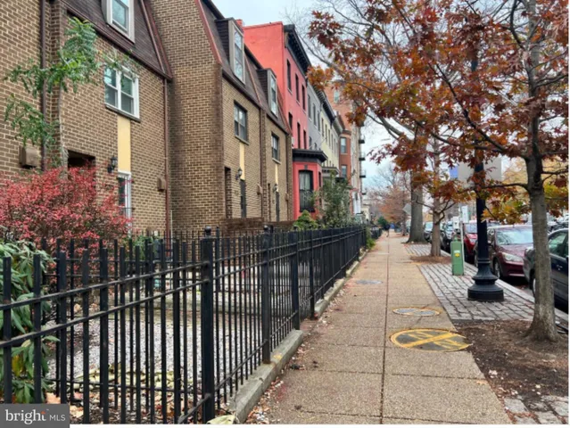 a city street lined with tall buildings