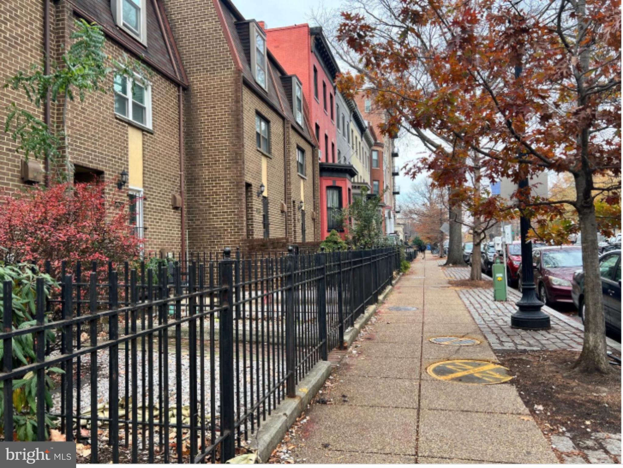 1206 11th Street Northwest Washington, DC 20005 - Photo 15 of 44 a city street lined with tall buildings
