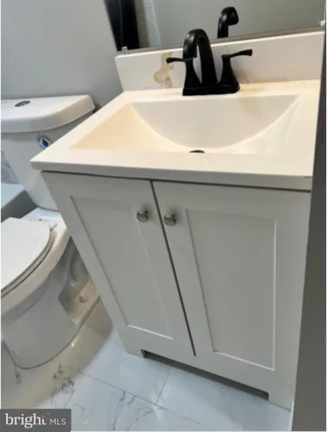 a bathroom with a sink and toilet