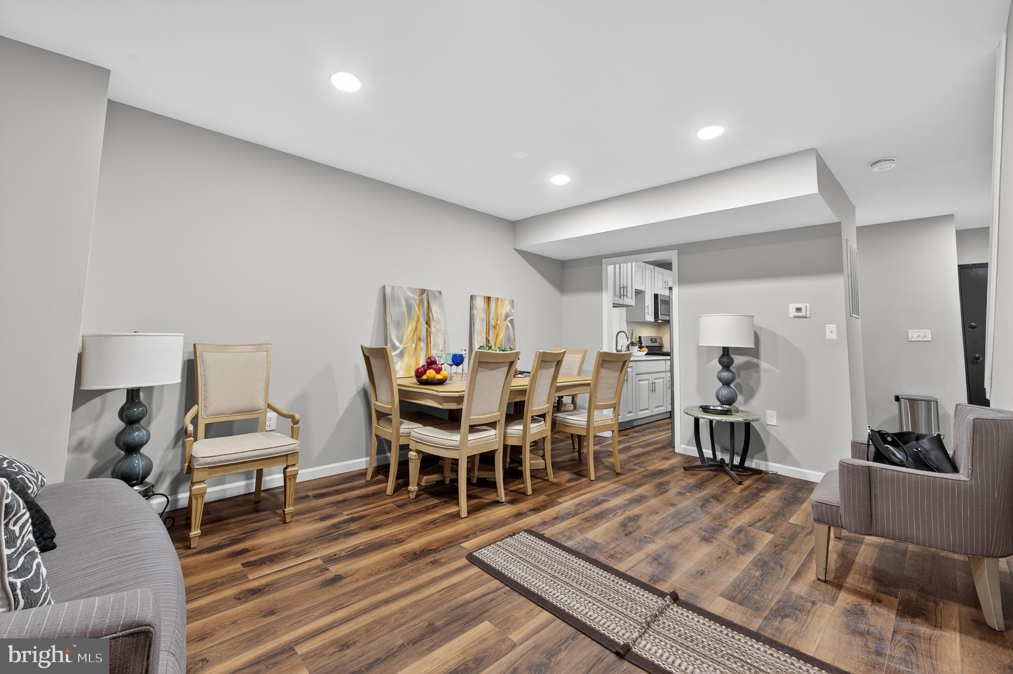 1206 11th Street Northwest Washington, DC 20005 - Photo 2 of 44 a living room with furniture and a wooden floor