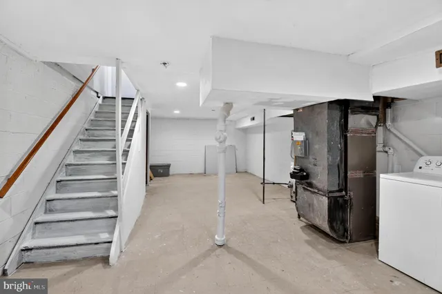 a bed room with a bed and a television