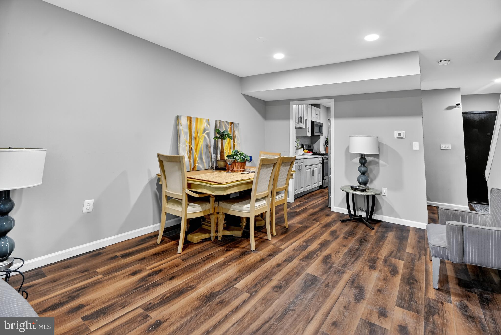 1206 11th Street Northwest Washington, DC 20005 - Photo 43 of 44 a dining room with furniture and wooden floor