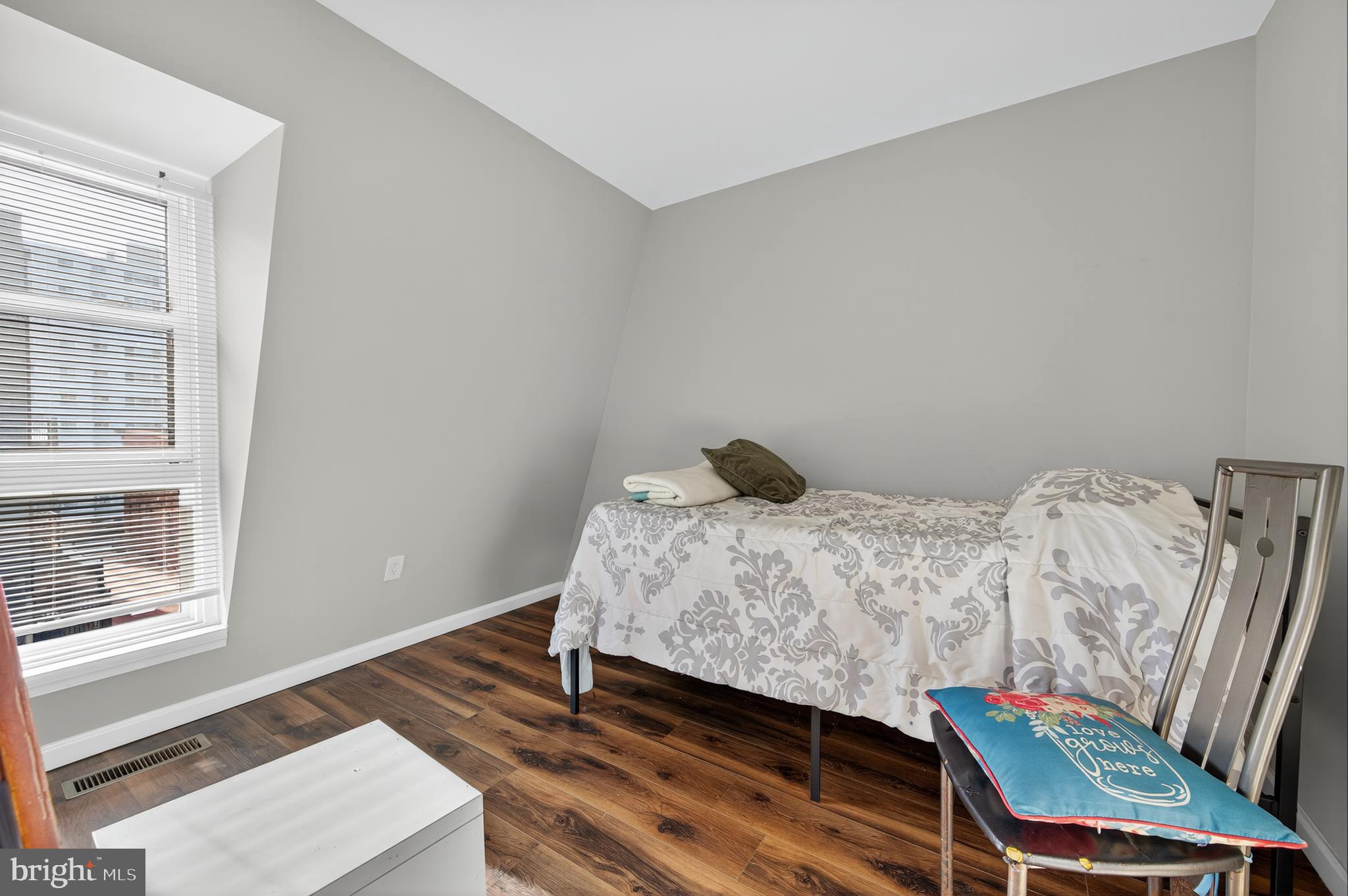 1206 11th Street Northwest Washington, DC 20005 - Photo 5 of 44 a bedroom with a bed and a window