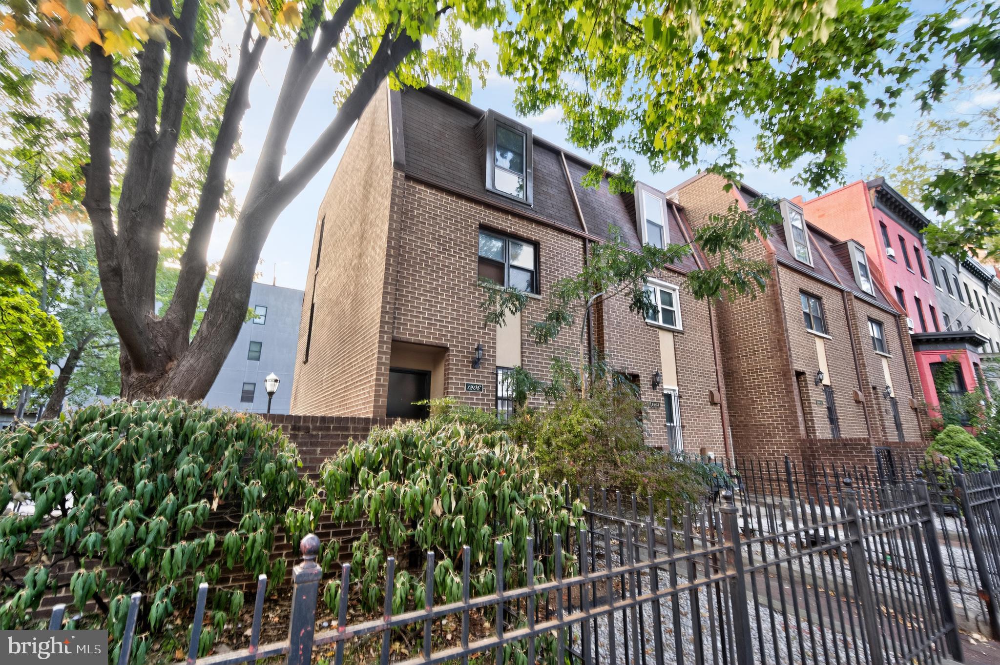 1206 11th Street Northwest Washington, DC 20005 - Photo 9 of 44 a front view of a house with a yard
