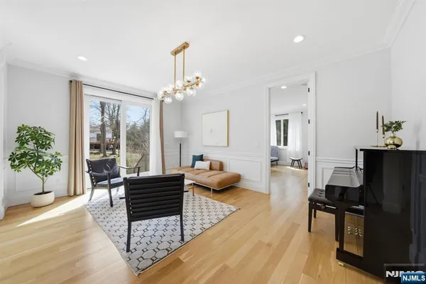 a spacious bedroom with a bed and a flat screen tv