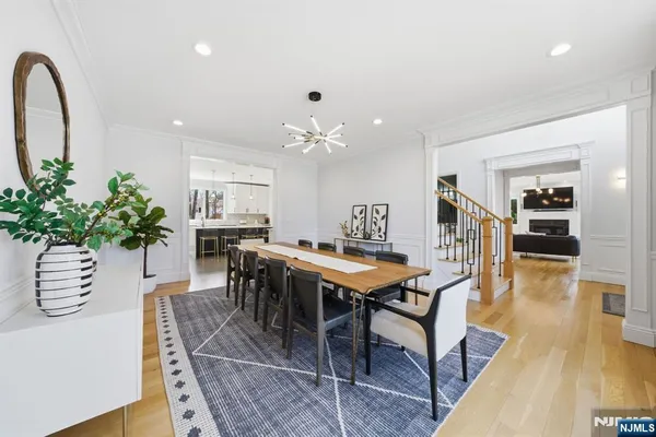a living room with furniture a dining table and a piano