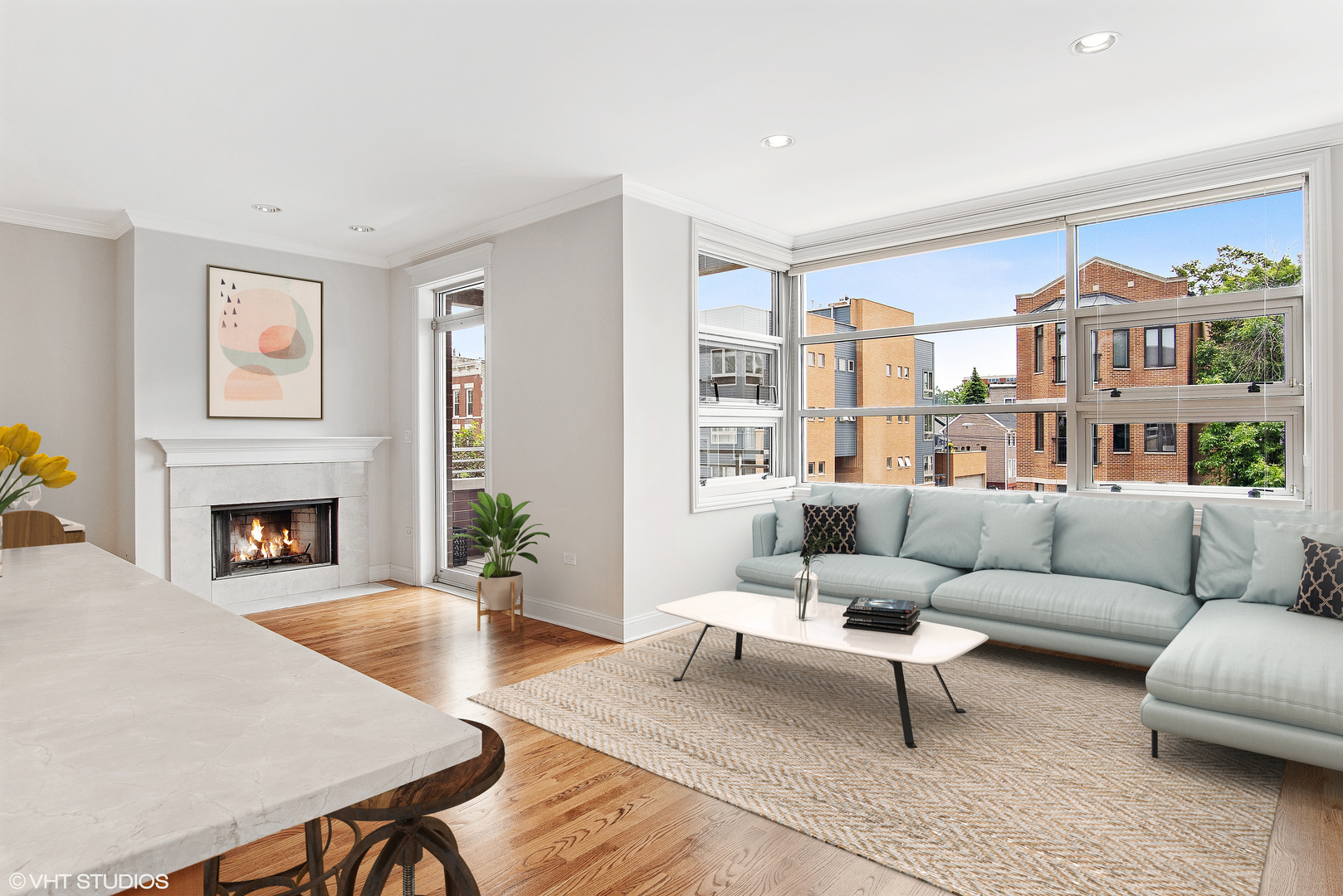 1502 West Augusta Boulevard, Unit 3W Chicago, IL 60642 - Photo 2 of 23 a living room with furniture and a fireplace