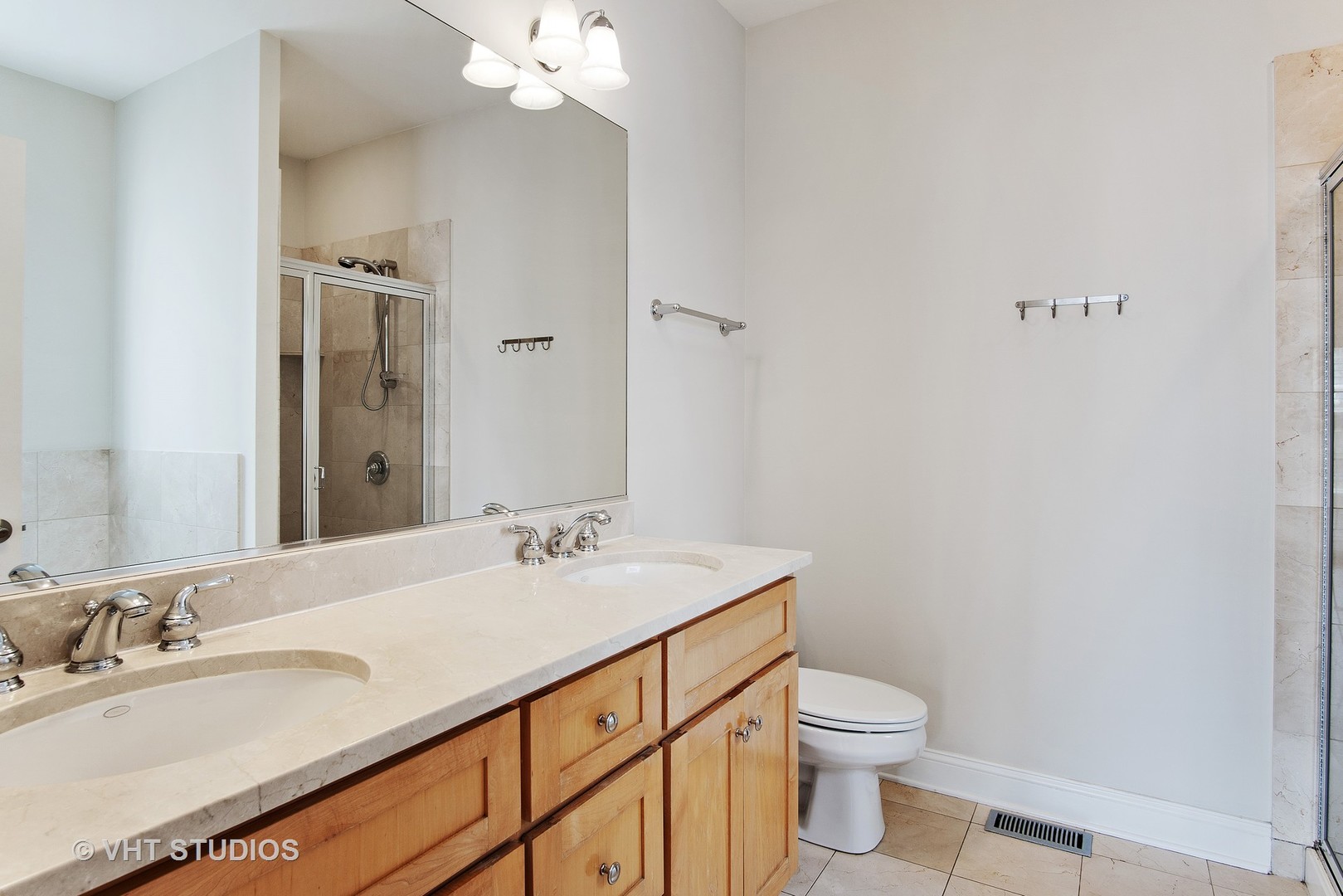 1502 West Augusta Boulevard, Unit 3W Chicago, IL 60642 - Photo 14 of 23 a bathroom with a granite countertop sink a toilet and a mirror