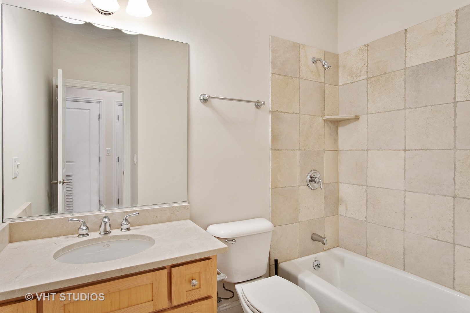 1502 West Augusta Boulevard, Unit 3W Chicago, IL 60642 - Photo 20 of 23 a bathroom with a granite countertop sink a toilet and shower