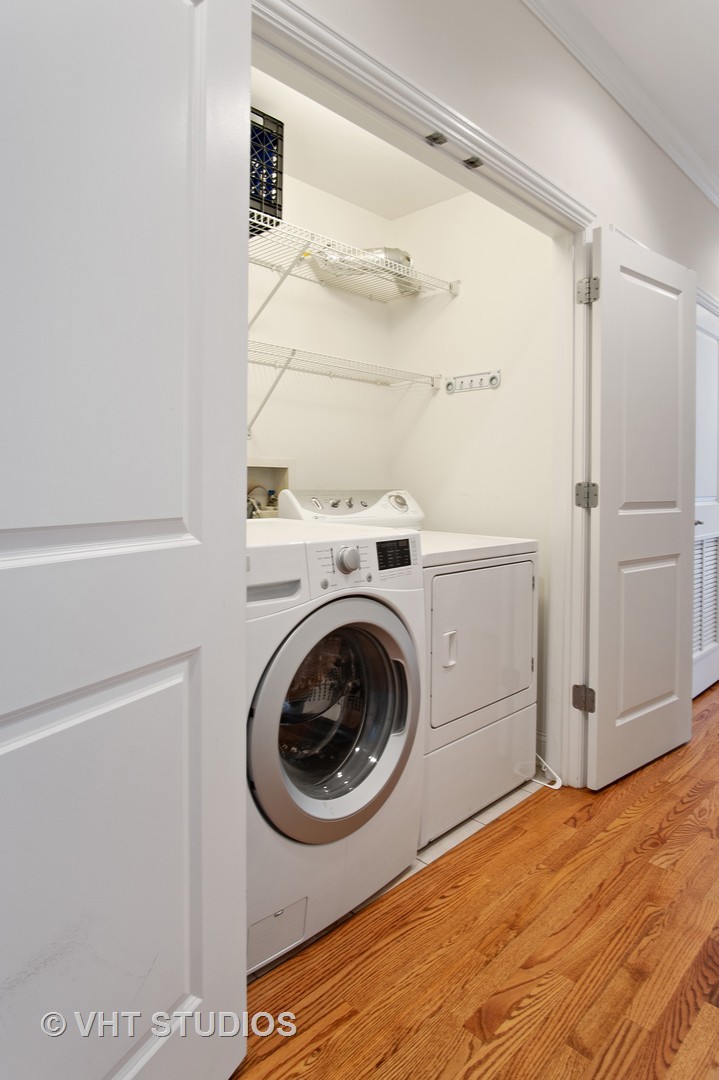 1502 West Augusta Boulevard, Unit 3W Chicago, IL 60642 - Photo 21 of 23 a utility room with dryer and washer