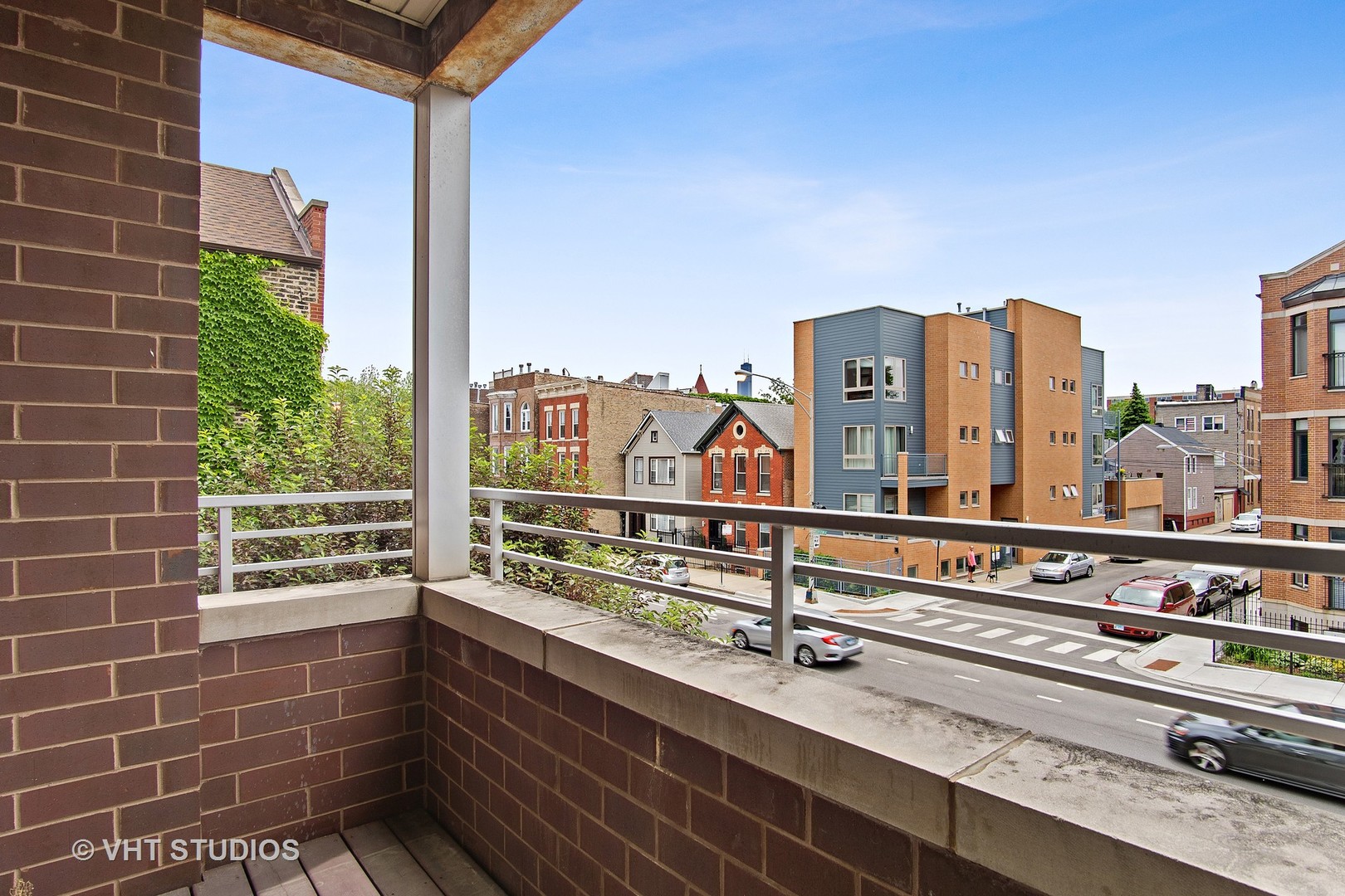 1502 West Augusta Boulevard, Unit 3W Chicago, IL 60642 - Photo 22 of 23 a view of buildings from the balcony